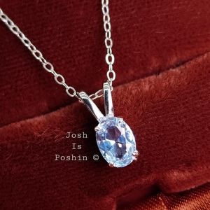 Oval sky blue topaz pendant necklace in sterling silver